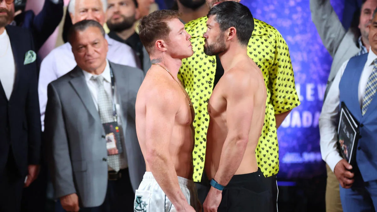 Featured image for Canelo Alvarez defeats John Ryder in boxing match.