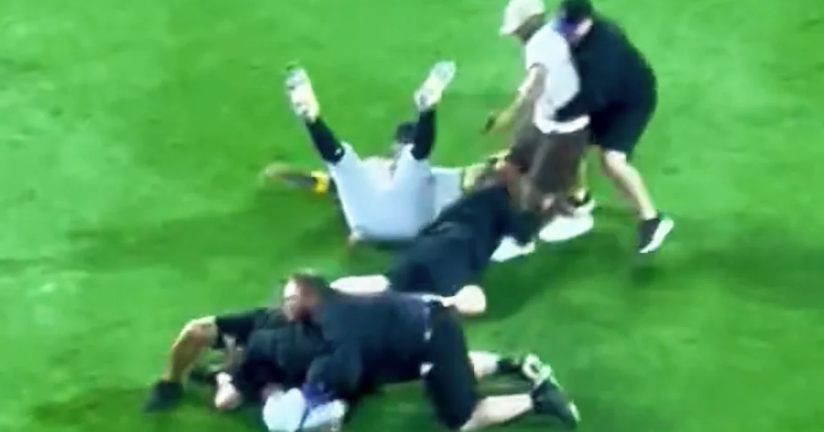 Featured image for Fans Storm Field to Confront Atlanta Braves' Ronald Acuña Jr.