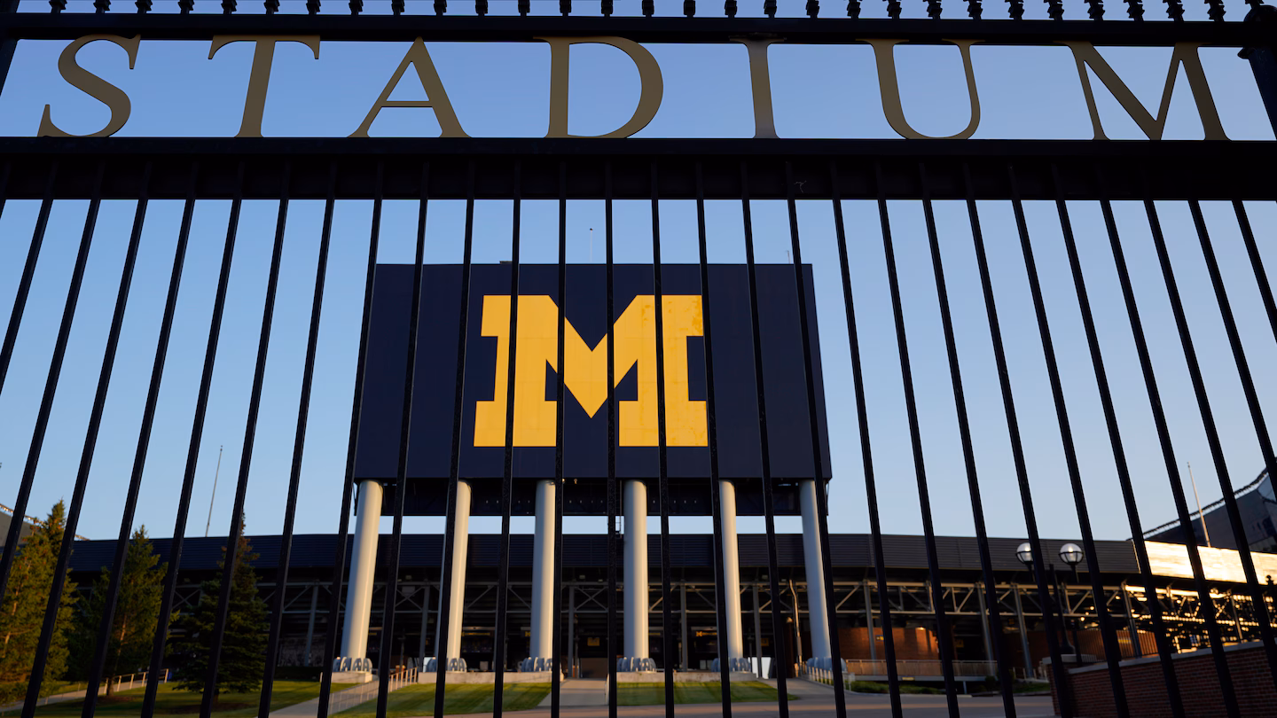 Featured image for Schembechler family members resign from Michigan positions over social media controversy.