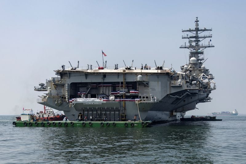 US combat ship docks in Vietnam amidst South China Sea tensions.