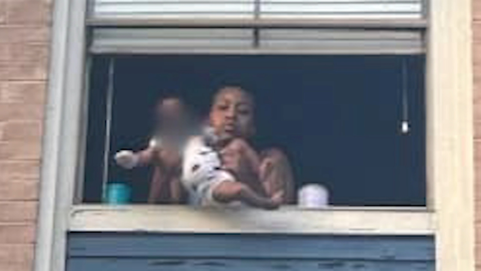 Featured image for Woman charged for endangering infant by holding out of third-story window.