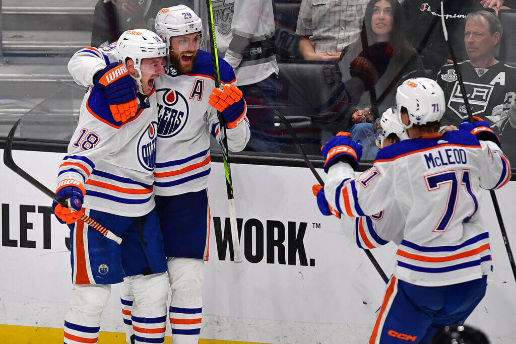Featured image for Oilers triumph over Kings in Game 4 with Hyman's OT winner.