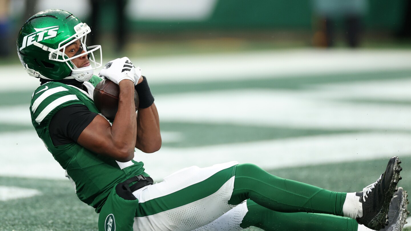 Featured image for Adonai Mitchell Shines with First NFL Touchdown and Promising Performance