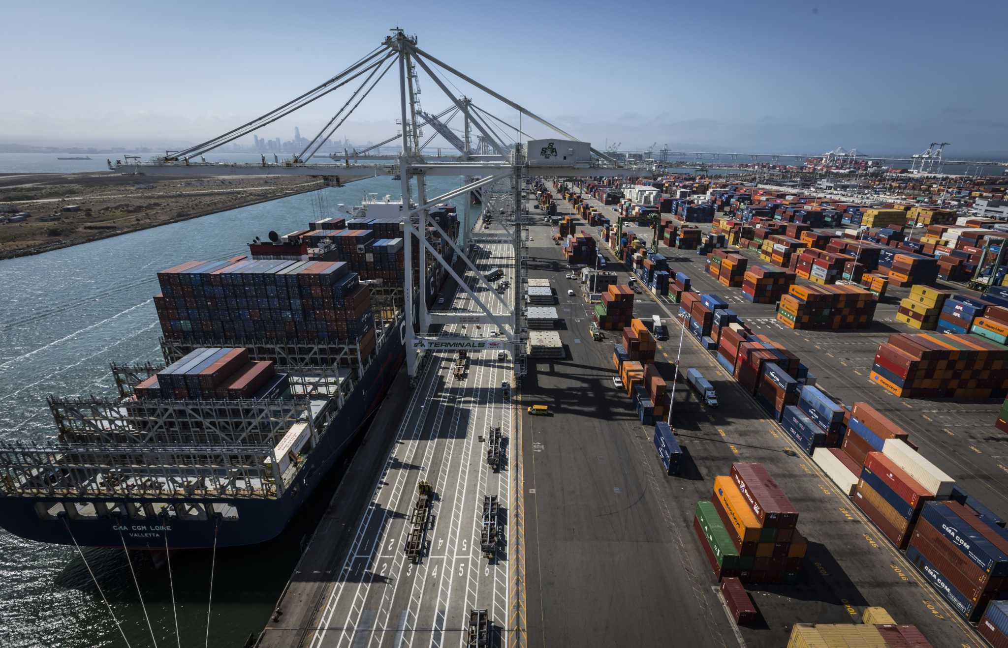 Featured image for Union worker strikes halt West Coast port operations.