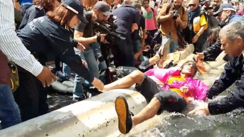 Featured image for Climate activists cause chaos at Rome's Trevi Fountain.