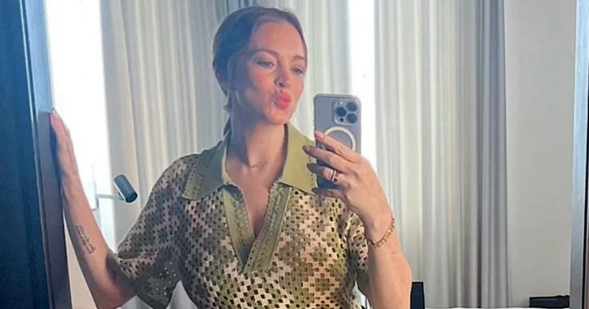 Lindsay Lohan flaunts baby bump in NYC trip.