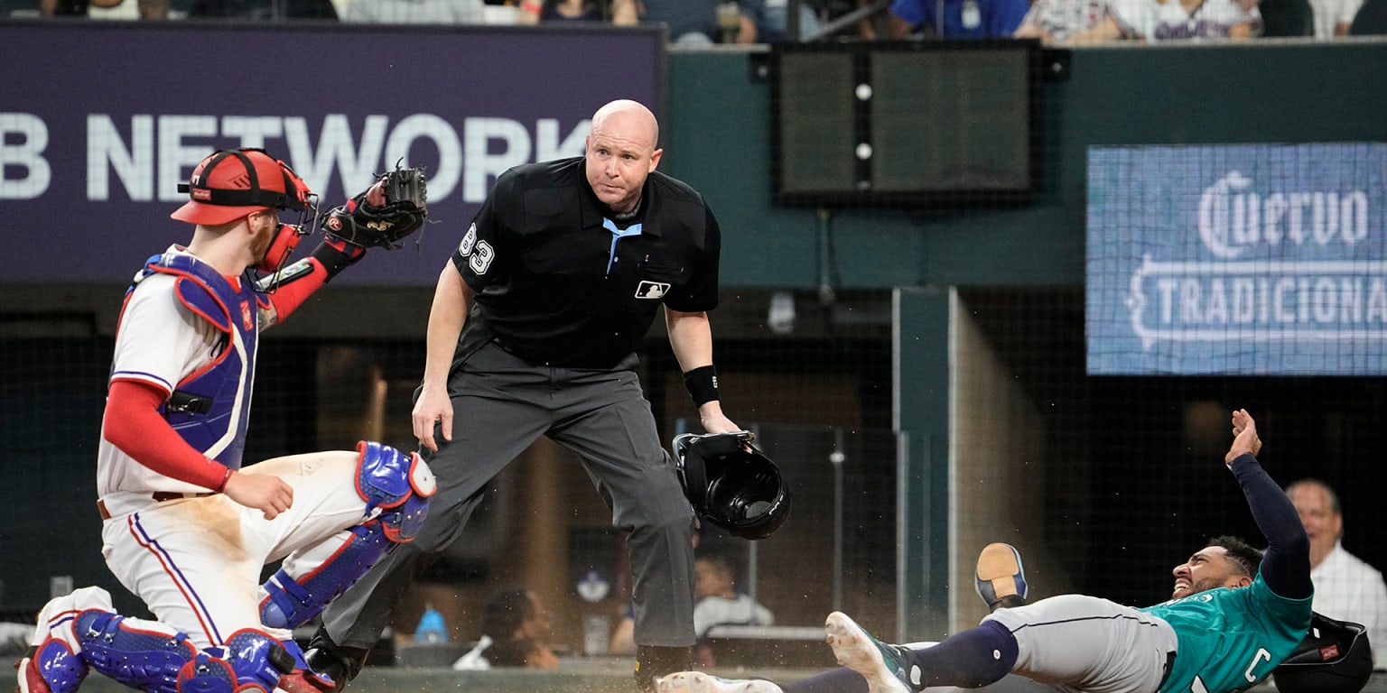 Featured image for Rangers defeat Mariners with catcher's game-saving tag.