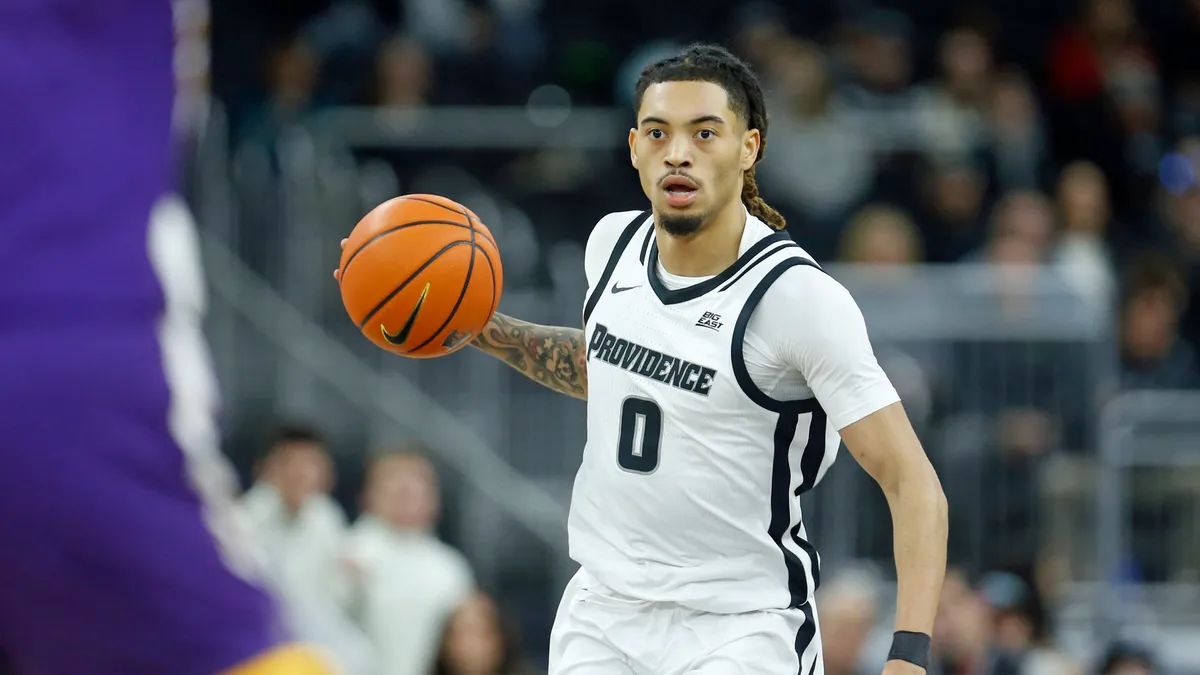 Featured image for Providence College basketball player suspended after domestic dispute and gun charges.