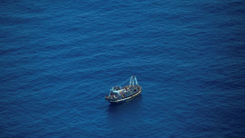Featured image for 400 migrants stranded on drifting boat in Mediterranean Sea.
